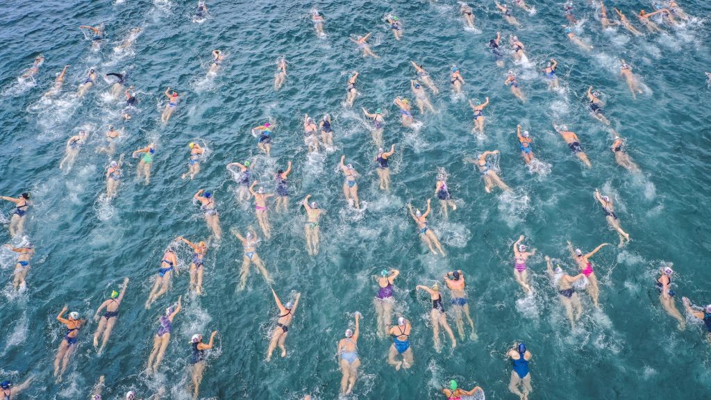 A white water swimming race. No lanes, all the participants rush to the finish at the same time, even if it means colliding.